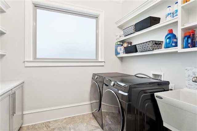486 Cercle Du Lac, Covington, LA 70433 - washroom with washer and clothes dryer, baseboards, cabinet space, and light marble finish flooring