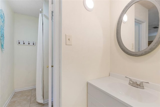 41376 Dunson Rd, Ponchatoula, LA 70454 - bathroom featuring vanity, tile patterned floors, and baseboards