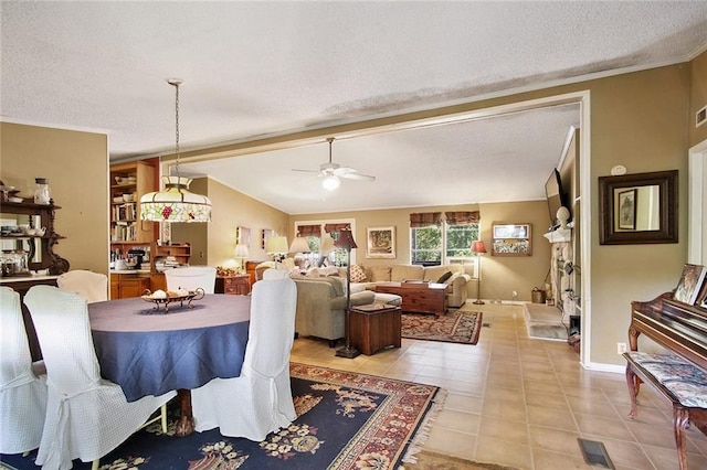 16768 Kat Kaw Rd, Franklinton, LA 70438 - dining area featuring ceiling fan, a textured ceiling, vaulted ceiling, and light tile patterned floors