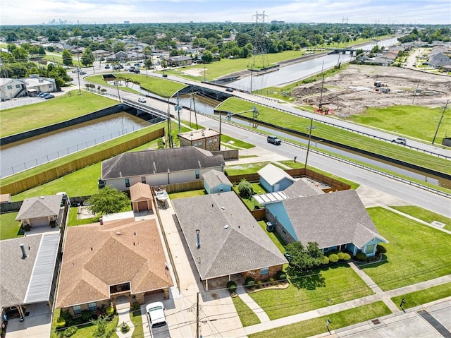 aerial view of residential area with a nearby body of water