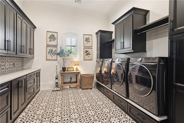 181 Windermere Way, Madisonville, LA 70447 - laundry room featuring cabinet space, separate washer and dryer, ornamental molding, and baseboards