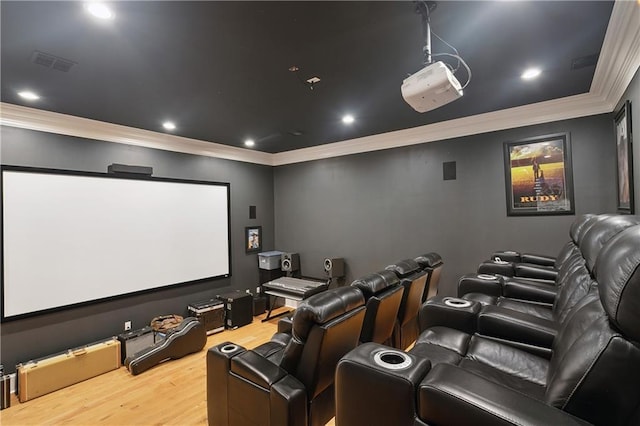 181 Windermere Way, Madisonville, LA 70447 - home theater room with wood finished floors, ornamental molding, and recessed lighting