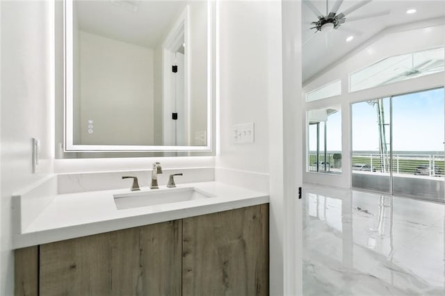 8116 Breakwater Dr, New Orleans, LA 70124 - bathroom with vanity, a water view, marble finish flooring, recessed lighting, and lofted ceiling