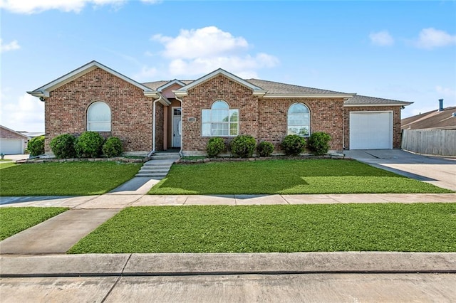 3945 Jean Lafitte Pkwy, Chalmette, LA 70043 - ranch-style home with concrete driveway, an attached garage, and brick siding