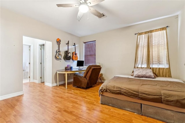 3945 Jean Lafitte Pkwy, Chalmette, LA 70043 - bedroom featuring light wood-type flooring, baseboards, ceiling fan, and ensuite bathroom