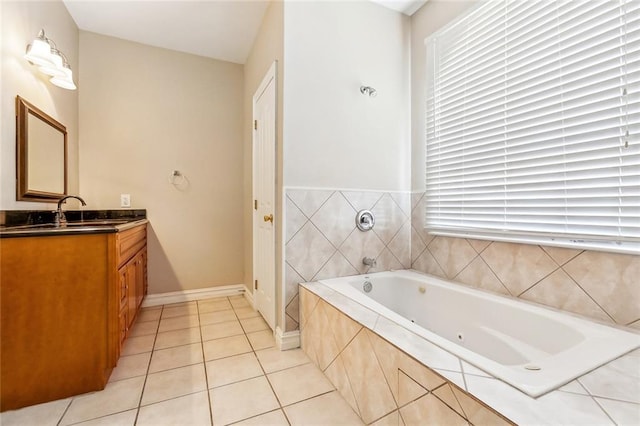 3945 Jean Lafitte Pkwy, Chalmette, LA 70043 - bathroom featuring vanity, a garden tub, and tile patterned floors