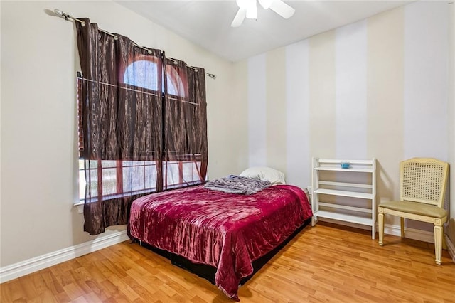 3945 Jean Lafitte Pkwy, Chalmette, LA 70043 - bedroom featuring wood finished floors, baseboards, and a ceiling fan
