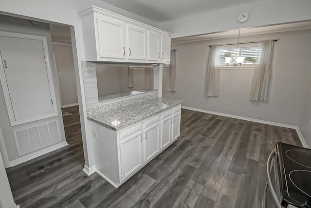 8209 Harris Ave, Harahan, LA 70123 - kitchen with white cabinets, stainless steel range with electric cooktop, dark wood-style flooring, and baseboards