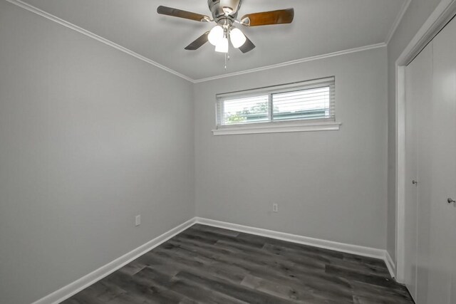 8209 Harris Ave, Harahan, LA 70123 - spare room with dark wood finished floors, crown molding, baseboards, and a ceiling fan