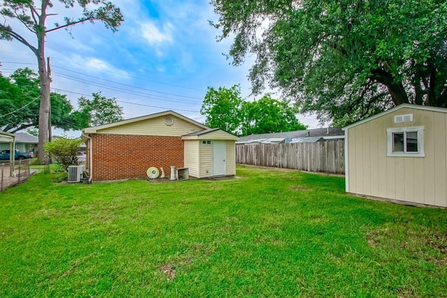 8209 Harris Ave, Harahan, LA 70123 - view of yard featuring a storage unit, an outdoor structure, and central AC