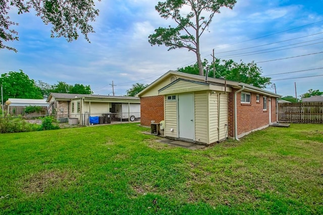 8209 Harris Ave, Harahan, LA 70123 - back of house with brick siding and an outbuilding