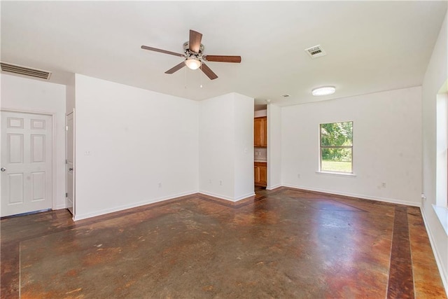 309 2nd Ave, Hammond, LA 70403 - spare room featuring finished concrete floors, a ceiling fan, and baseboards