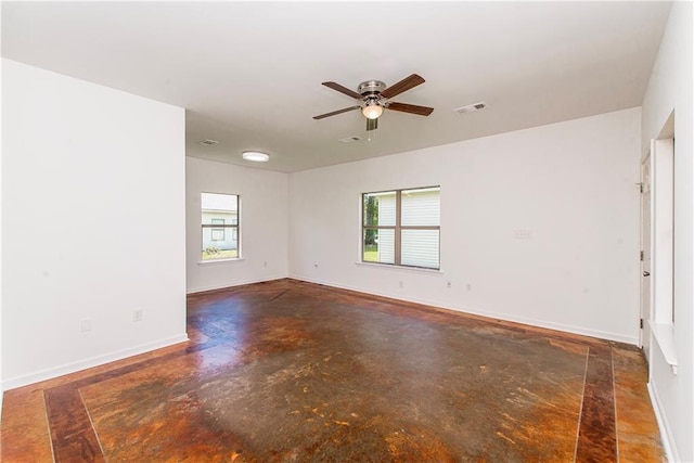 309 2nd Ave, Hammond, LA 70403 - unfurnished room with finished concrete floors, ceiling fan, and baseboards