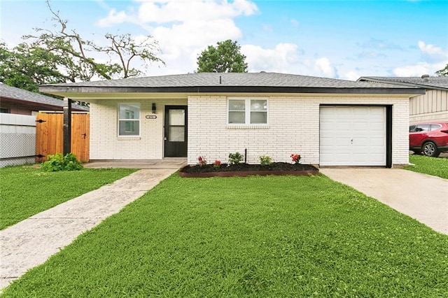 672 Wiegand Dr, Westwego, LA 70094 - ranch-style house featuring concrete driveway, brick siding, and a garage