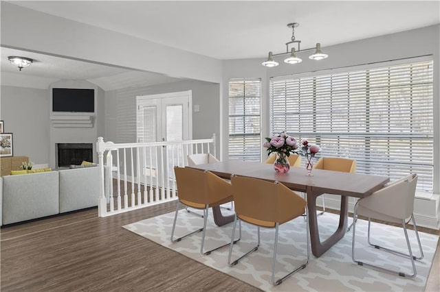 112 Napoleon Ave Unit 30, Slidell, LA 70460 - dining area featuring wood finished floors, plenty of natural light, and a fireplace