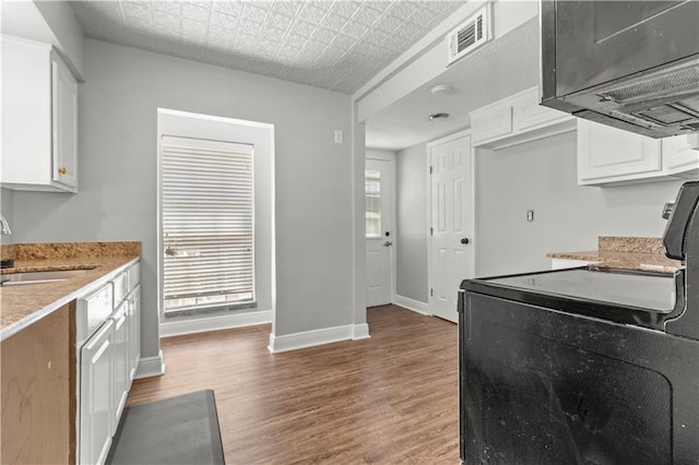 112 Napoleon Ave Unit 30, Slidell, LA 70460 - kitchen with a sink, black electric range, wood finished floors, baseboards, and white cabinets