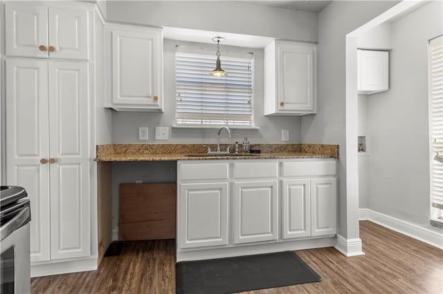 112 Napoleon Ave Unit 30, Slidell, LA 70460 - kitchen with a sink, white cabinets, and wood finished floors