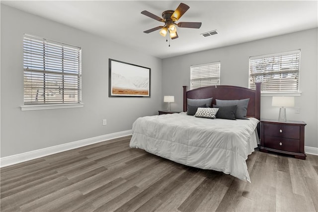 112 Napoleon Ave Unit 30, Slidell, LA 70460 - bedroom featuring wood finished floors, multiple windows, and a ceiling fan