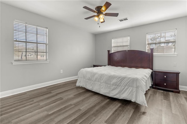 112 Napoleon Ave Unit 30, Slidell, LA 70460 - bedroom featuring wood finished floors, multiple windows, and ceiling fan