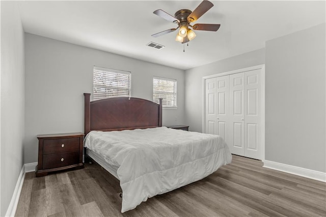 112 Napoleon Ave Unit 30, Slidell, LA 70460 - bedroom with wood finished floors, a closet, baseboards, and ceiling fan