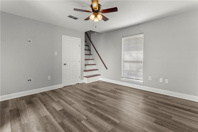 112 Napoleon Ave Unit 30, Slidell, LA 70460 - unfurnished room with a ceiling fan, dark wood-style floors, stairway, and baseboards