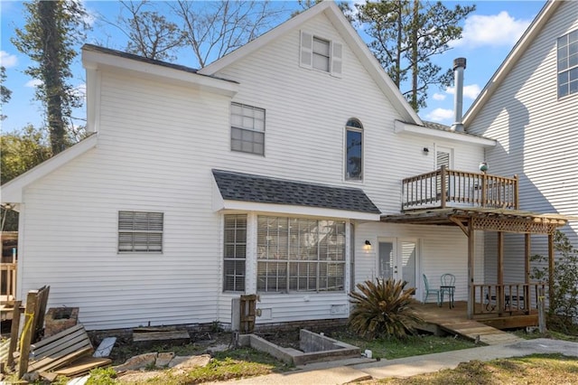 112 Napoleon Ave Unit 30, Slidell, LA 70460 - rear view of house with a balcony, a shingled roof, and a garden