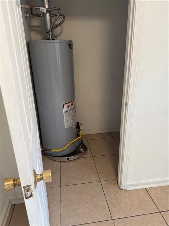 utility room with gas water heater