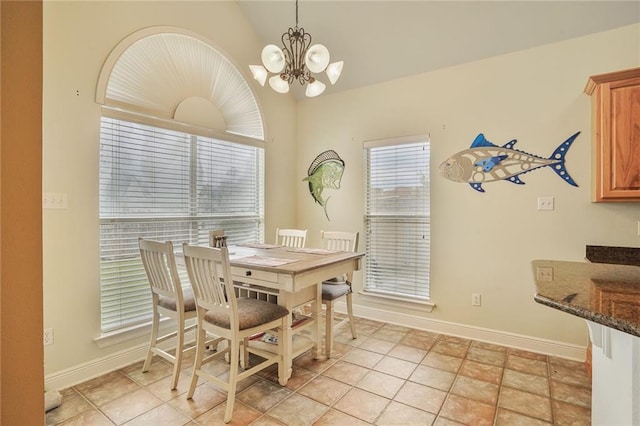 119 Kasey St, Slidell, LA 70458 - dining space featuring vaulted ceiling, a chandelier, and baseboards