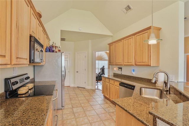 119 Kasey St, Slidell, LA 70458 - kitchen with stainless steel appliances, a sink, light brown cabinetry, vaulted ceiling, and stone countertops