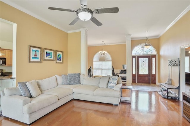 119 Kasey St, Slidell, LA 70458 - living area with crown molding, a ceiling fan, ornate columns, and wood finished floors