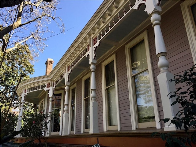 view of property exterior featuring a chimney