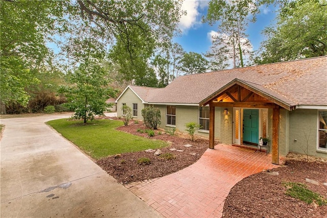 156 Oak Holw, Hammond, LA 70401 - view of front of property with a front lawn and roof with shingles