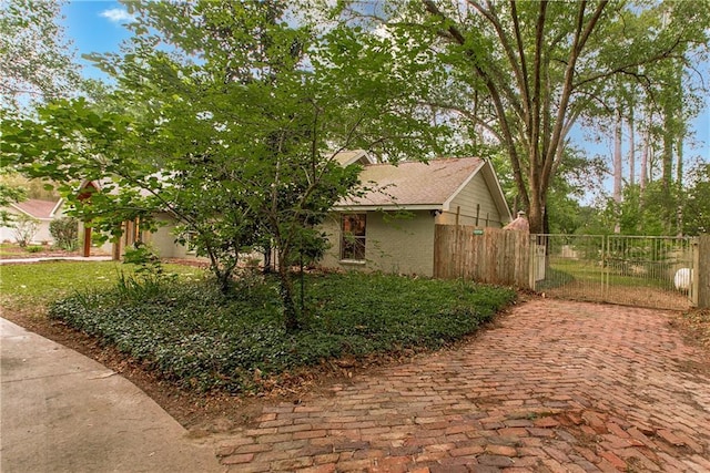 156 Oak Holw, Hammond, LA 70401 - view of home's exterior featuring fence and brick siding
