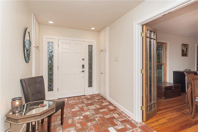 156 Oak Holw, Hammond, LA 70401 - entryway with baseboards, brick flooring, and recessed lighting