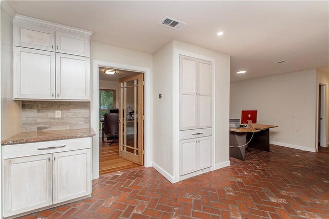 156 Oak Holw, Hammond, LA 70401 - kitchen with an office area, baseboards, brick floors, recessed lighting, and white cabinets