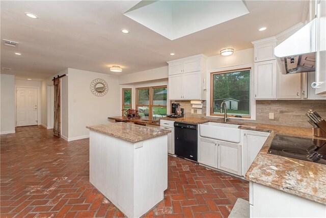 156 Oak Holw, Hammond, LA 70401 - kitchen with black appliances, brick flooring, a sink, under cabinet range hood, and recessed lighting