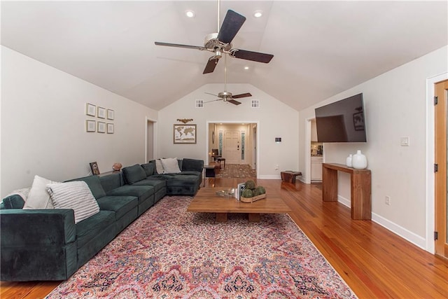 156 Oak Holw, Hammond, LA 70401 - living area with ceiling fan, vaulted ceiling, wood finished floors, and baseboards