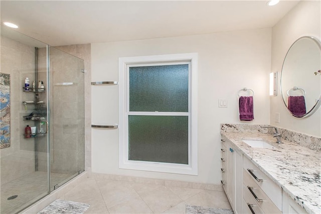 156 Oak Holw, Hammond, LA 70401 - bathroom featuring a stall shower, tile patterned flooring, vanity, and recessed lighting