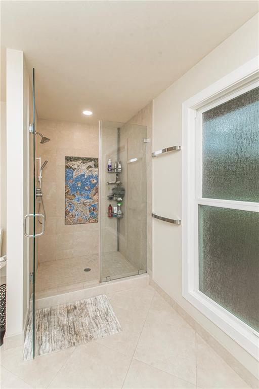 156 Oak Holw, Hammond, LA 70401 - full bathroom featuring a shower stall, tile patterned floors, recessed lighting, and baseboards