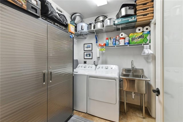 laundry room with washing machine and clothes dryer