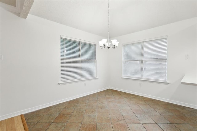 1155 Milan Dr, Mandeville, LA 70448 - unfurnished room with a chandelier and light tile patterned floors