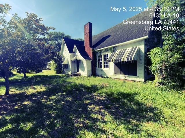 6396 10th Hwy, Greensburg, LA 70441 - rear view of property featuring a chimney