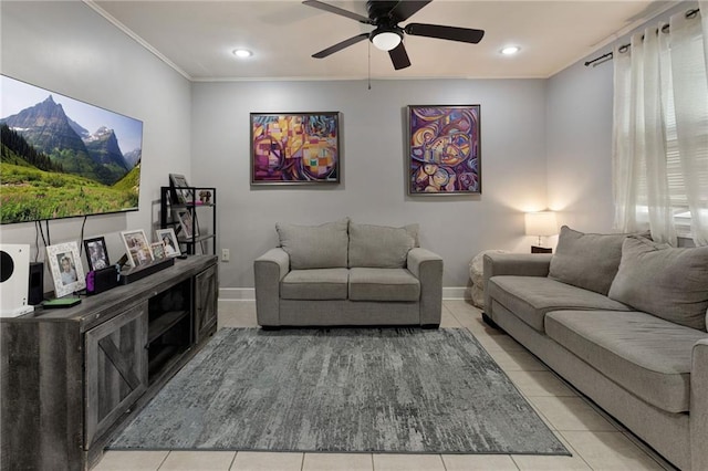 living room with light tile patterned flooring, a ceiling fan, ornamental molding, baseboards, and recessed lighting