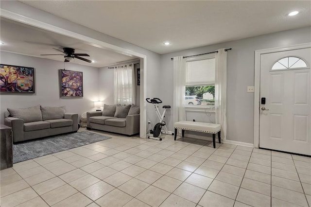 living room featuring ceiling fan, plenty of natural light, recessed lighting, light tile patterned flooring, and baseboards