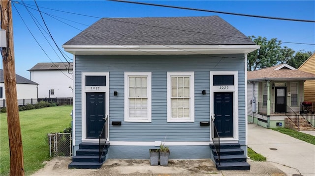 2025 Conti St, New Orleans, LA 70112 - shotgun-style home with entry steps and roof with shingles