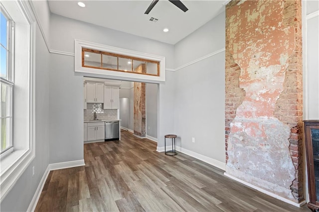 2025 Conti St, New Orleans, LA 70112 - unfurnished dining area with ceiling fan, a sink, wood finished floors, baseboards, and recessed lighting