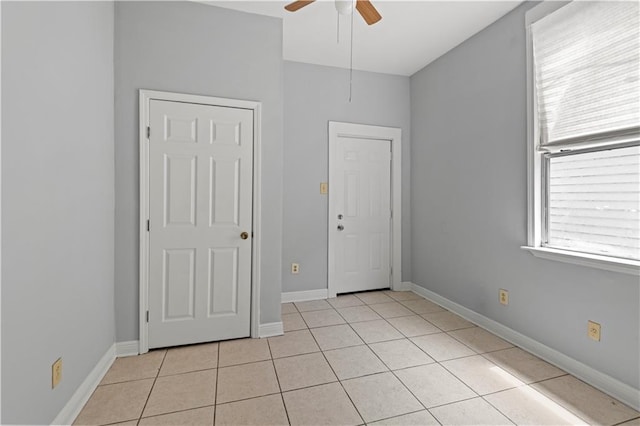 2025 Conti St, New Orleans, LA 70112 - unfurnished room featuring ceiling fan, light tile patterned floors, and baseboards