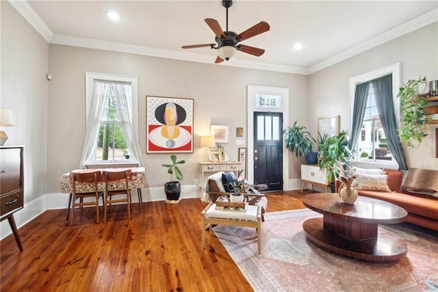 215 N Scott St, New Orleans, LA 70119 - living area featuring wood finished floors, ornamental molding, recessed lighting, ceiling fan, and baseboards