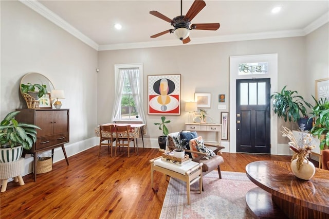 215 N Scott St, New Orleans, LA 70119 - living area featuring plenty of natural light, wood-type flooring, ceiling fan, crown molding, and baseboards