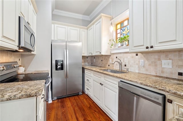 215 N Scott St, New Orleans, LA 70119 - kitchen with stainless steel appliances, a sink, dark wood-style flooring, backsplash, and ornamental molding